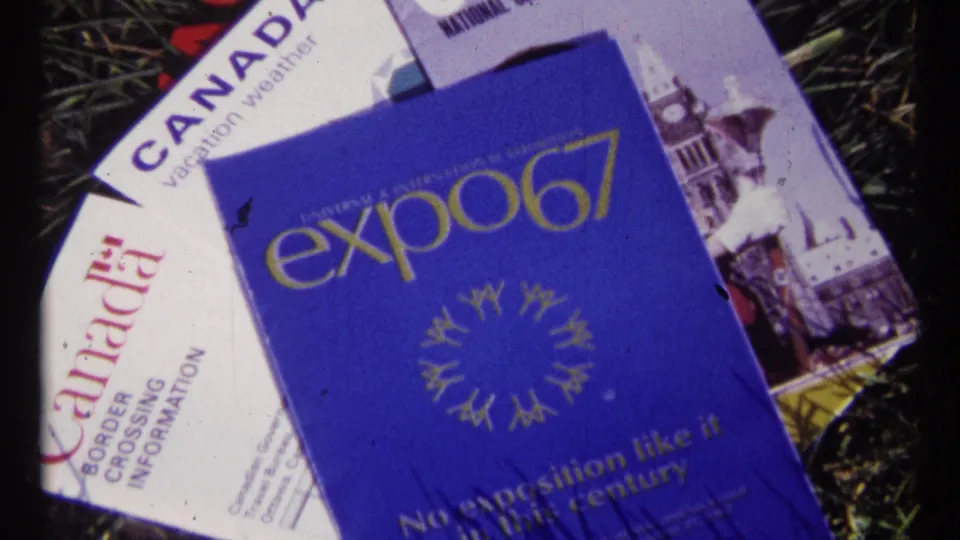Close 8mm view of an Expo 67 booklet with Canada and Ottawa travel brochures beneath it on grass, linked to the 1967 metadata.