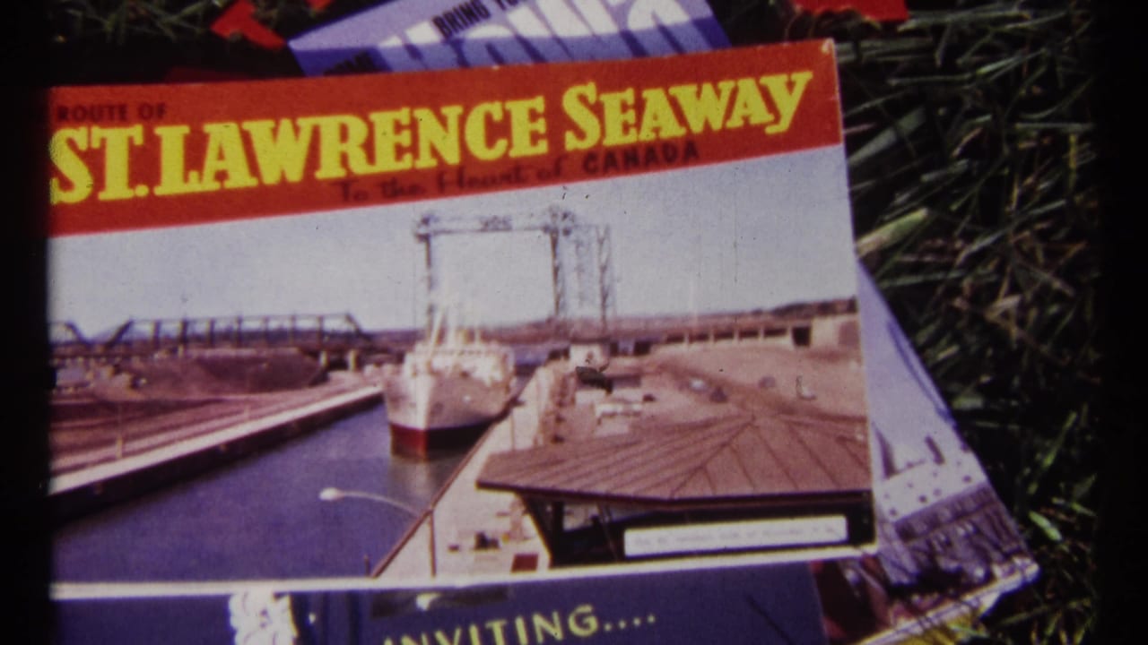 St. Lawrence Seaway route brochure lying on grass with a ship and canal scene printed on the cover.