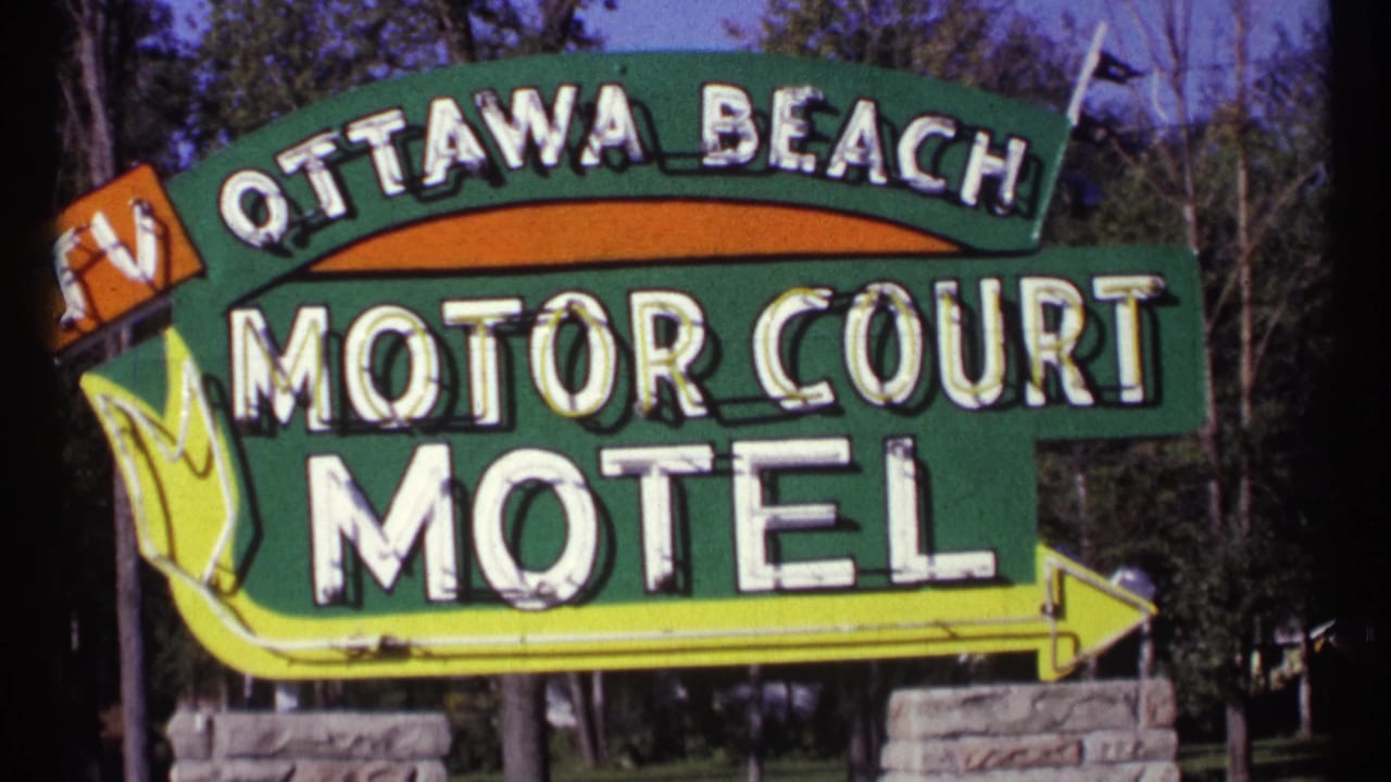 Ottawa Beach Motor Court Motel sign with large white lettering and a right-pointing arrow.