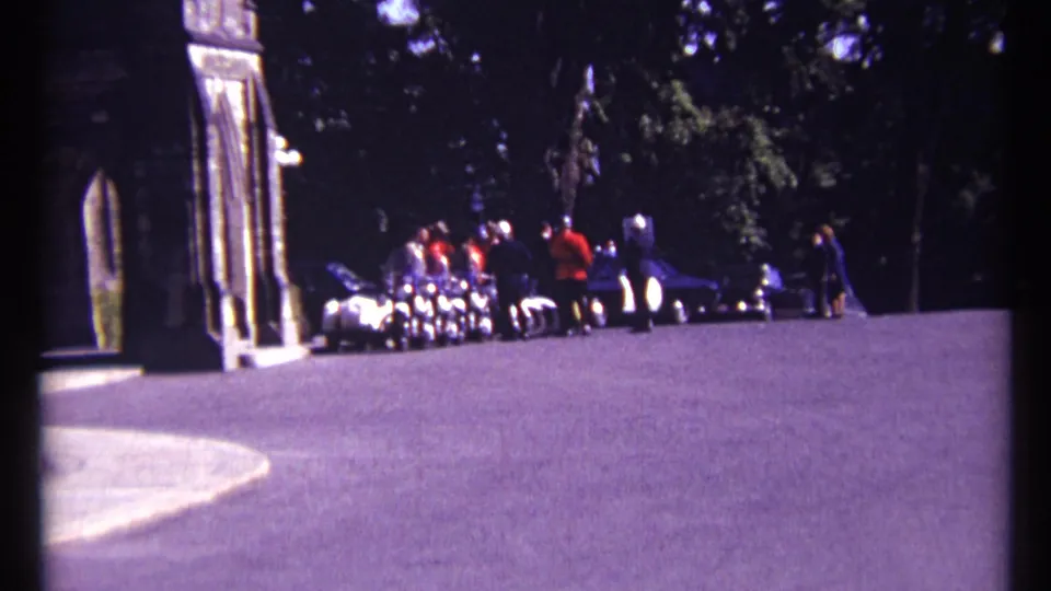 1967 Ottawa footage shows a wide visitor view of RCMP officers and people near a historic-looking stone entrance.