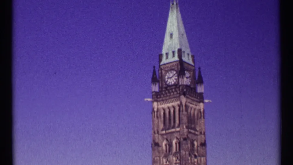 1967 Ottawa frame with the Peace Tower shifted right in the composition, showing the clock face, spire, and broad twilight-colored sky.