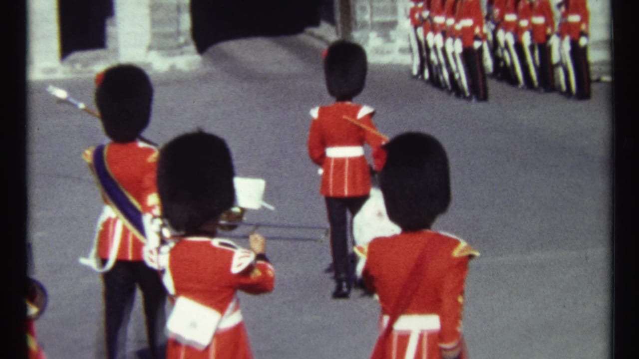 Uniformed guards and a white goat seen from behind during a parade formation.