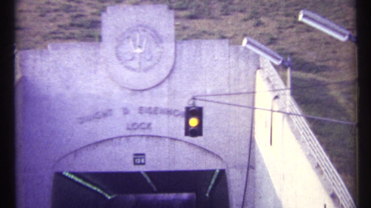 Dwight D. Eisenhower Lock entrance with traffic signal and stair railings.