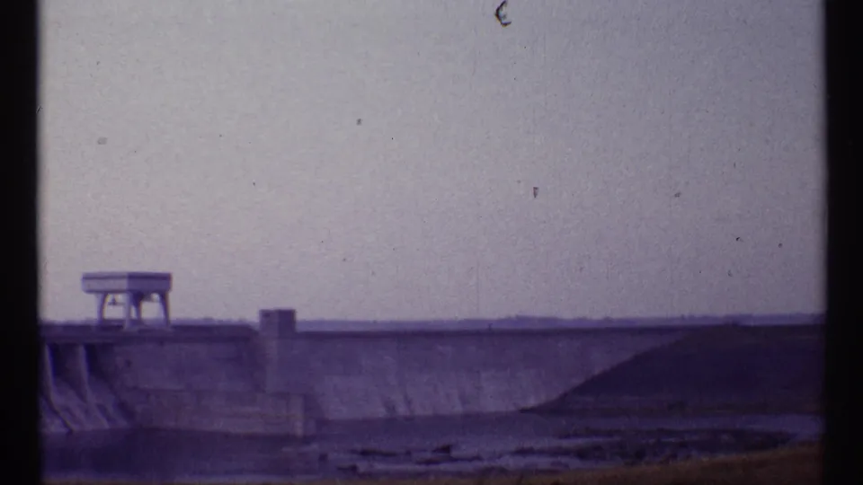 1967 Toronto 8mm view of the concrete structure continuing across the frame, with low ground visible below.