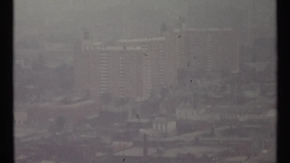Hazy Toronto city view from 1967 showing distant high-rises and urban structures through mist.