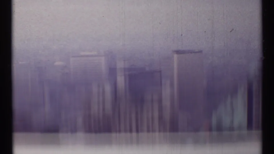A blurred 1967 Toronto skyline frame shows camera movement or exposure smear over tall buildings.