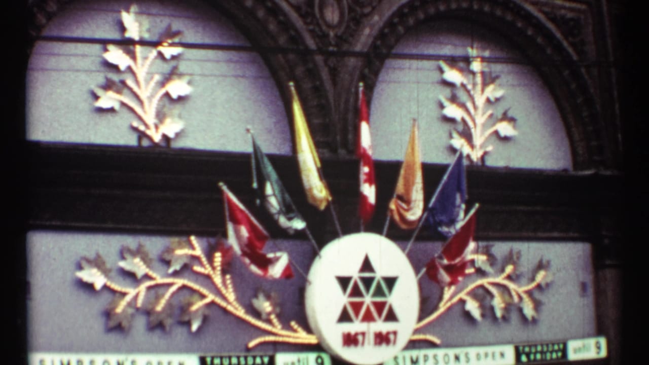Decorative Star of David display with flags and gold branches above a street marquee.
