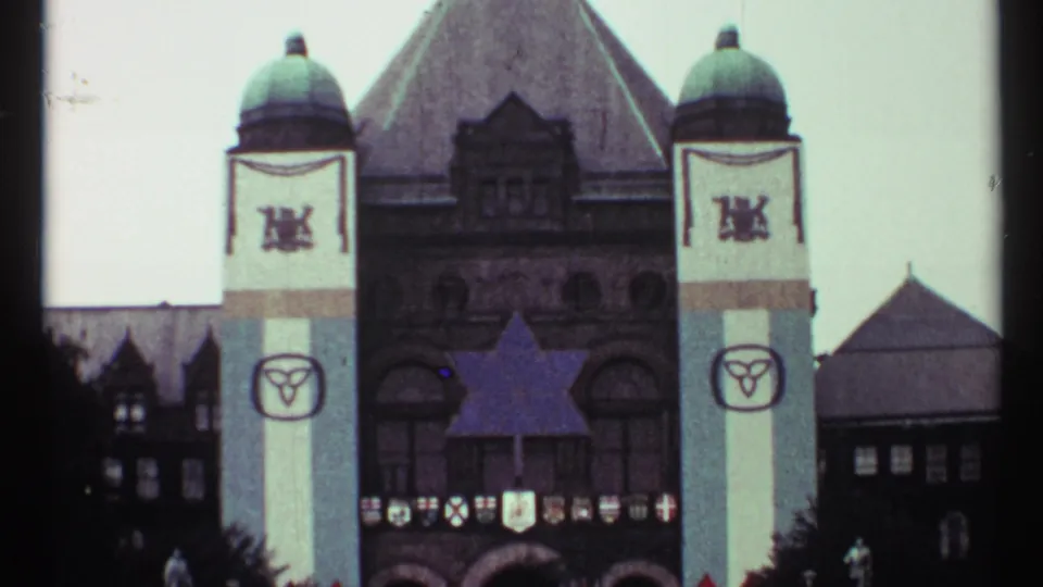1967 Toronto landmark view showing Old City Hall's towers, civic decorations, and a large Star of David above the entrance area.