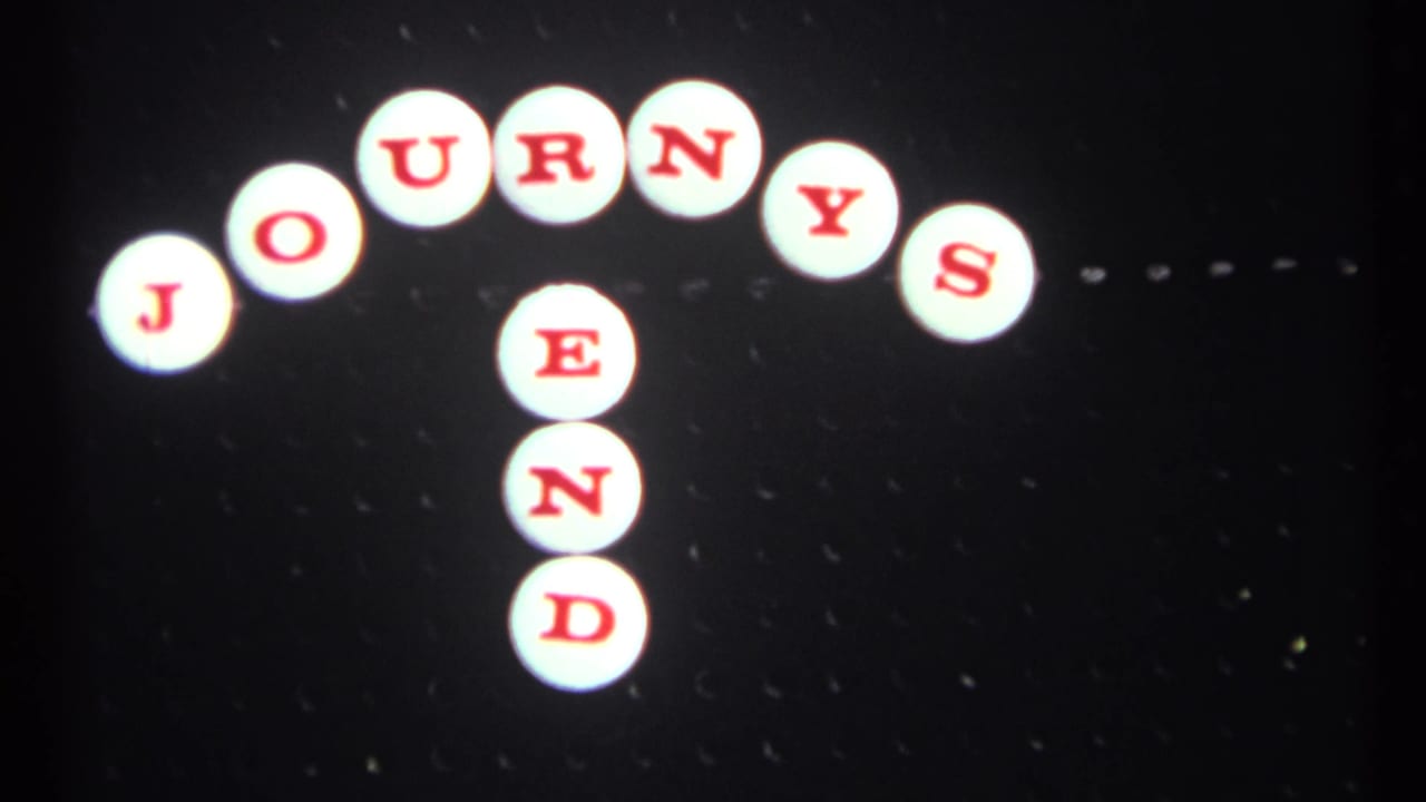 1967 8mm frame with title-style film leader text reading Journey's End against a dark, speckled background.
