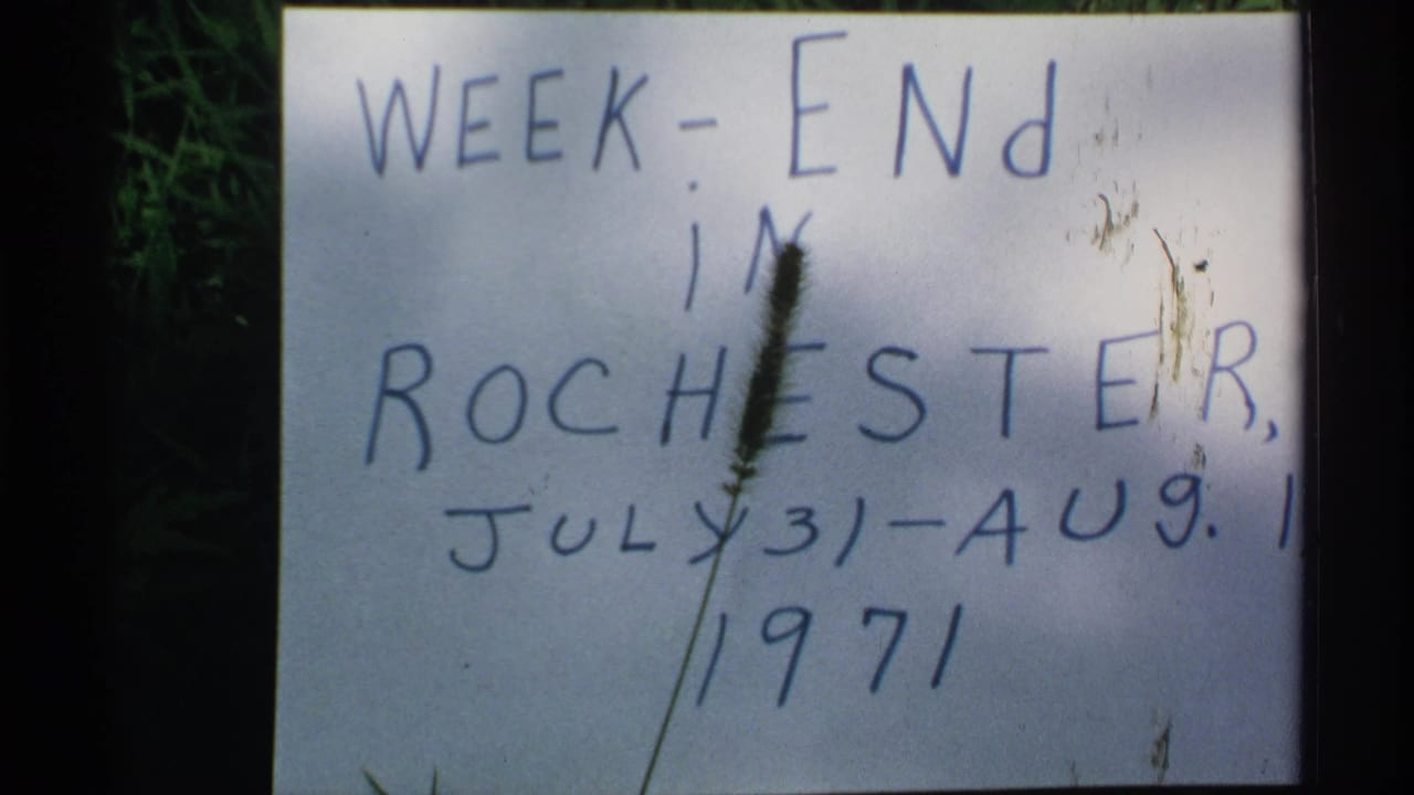 Handwritten weekend title card in grass with Rochester and 1971 date text.