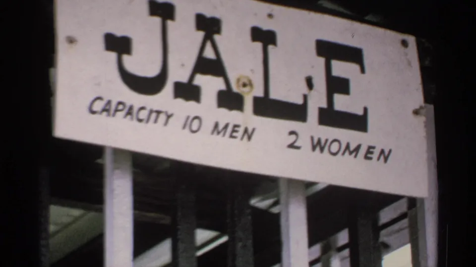 1970 Minnesota frame holding on the white JALE sign, with capacity text visible below the large letters.