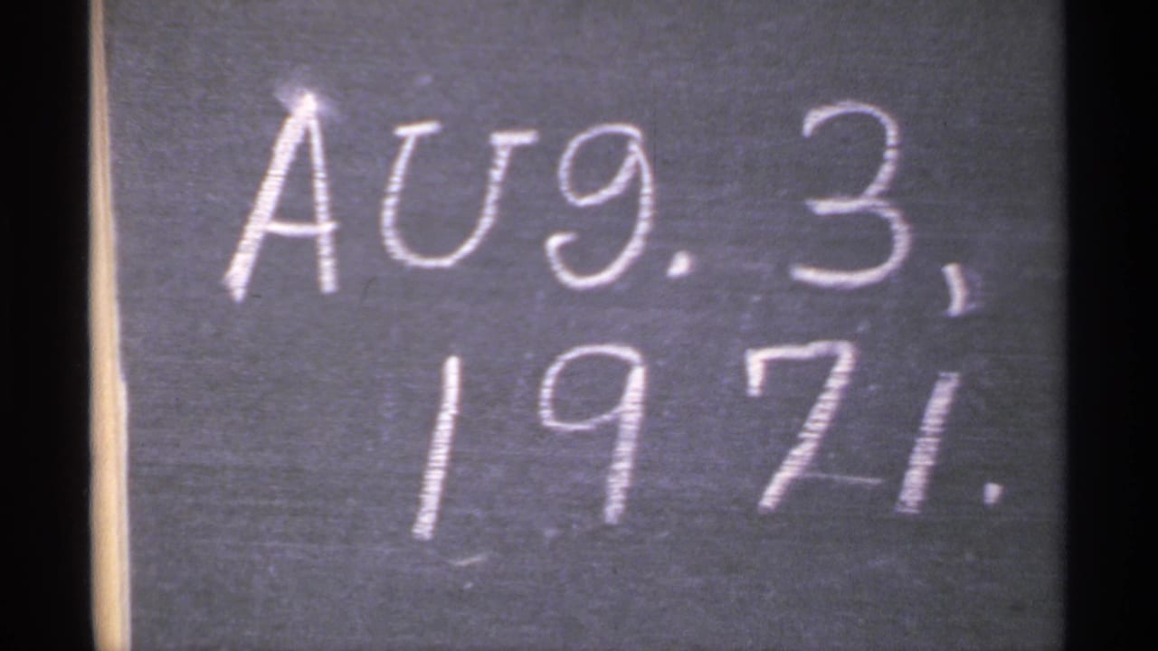 Close view of a chalkboard date reading Aug. 3, 1971 in a Minnesota home-movie clip.