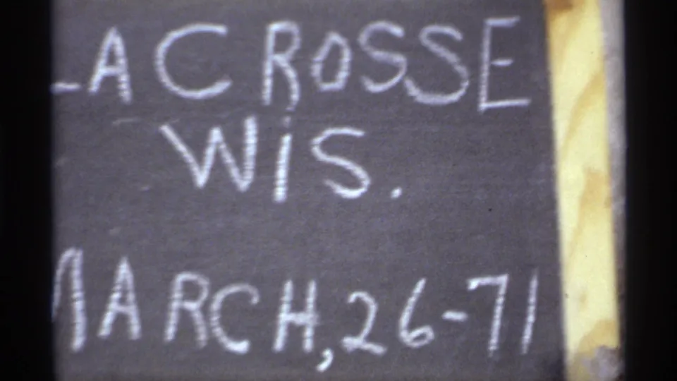 1971 home-movie title card for La Crosse, Wisconsin, with handwritten chalk text naming the location and date.