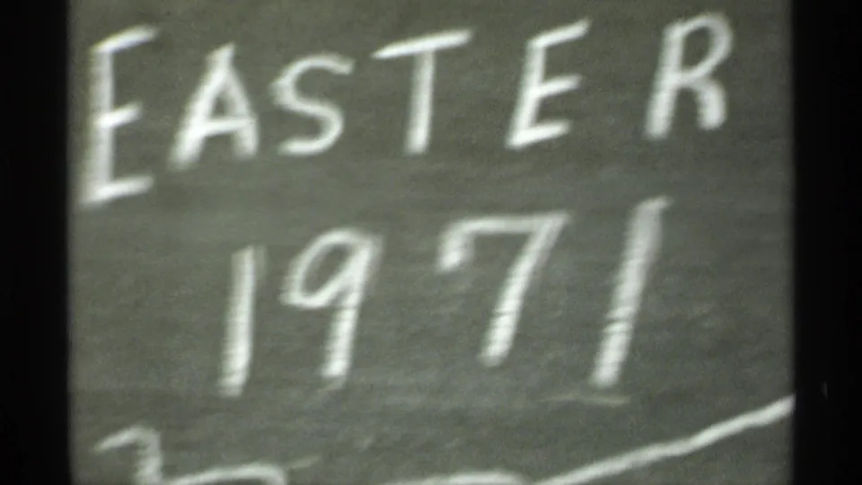 Handwritten home-movie title card reading EASTER 1971, filmed softly with visible grain and dark frame edges.