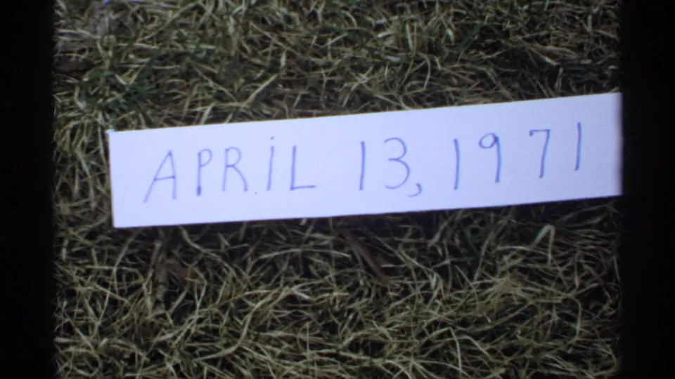 Handwritten April 13, 1971 date card on grass in the 8mm home-movie frame from La Crosse, Wisconsin.