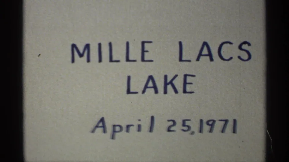 A handwritten title card fills the frame, reading Mille Lacs Lake and April 25, 1971, on a plain light background.
