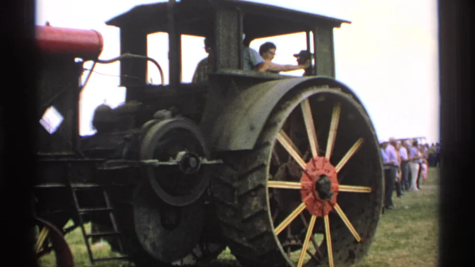 1971 Minnesota fair footage shows the steam tractor from the side, with an operator in the cab and onlookers gathered nearby.