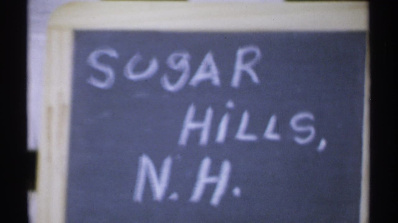Handwritten chalkboard sign reading Sugar Hills, N.H.