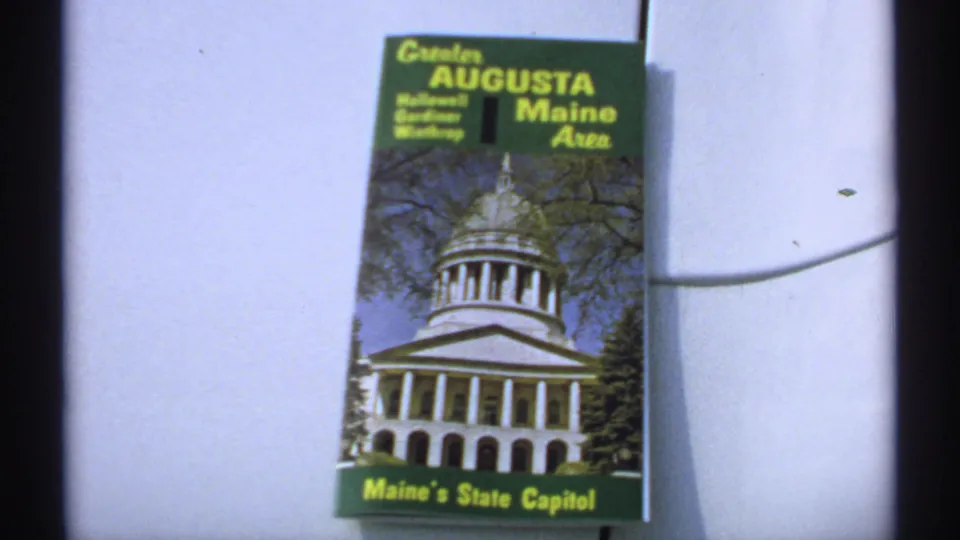 Travel brochure for the Greater Augusta, Maine area showing Maine's State Capitol, filmed as part of a 1971 New England trip record.