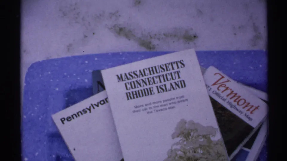 1971 8mm frame showing a Massachusetts, Connecticut, Rhode Island map over Pennsylvania and Vermont maps.