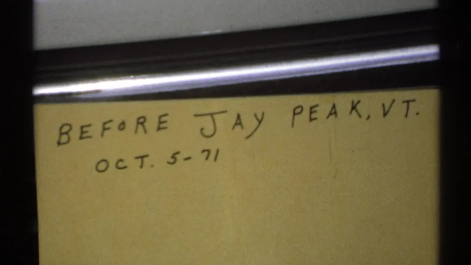 Tight 8mm view of the yellow handwritten card reading before Jay Peak, VT, with the Oct. 5-71 date below.