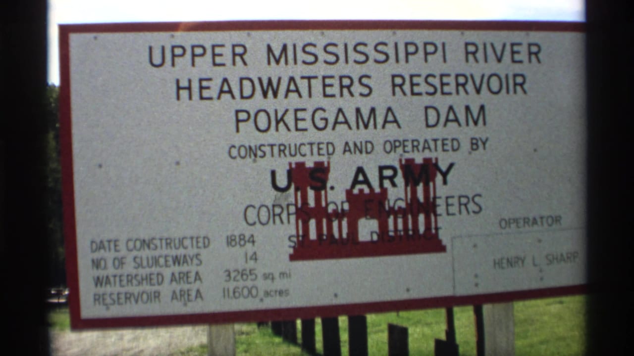 Close view of the Pokegama Dam sign with Army Corps text.