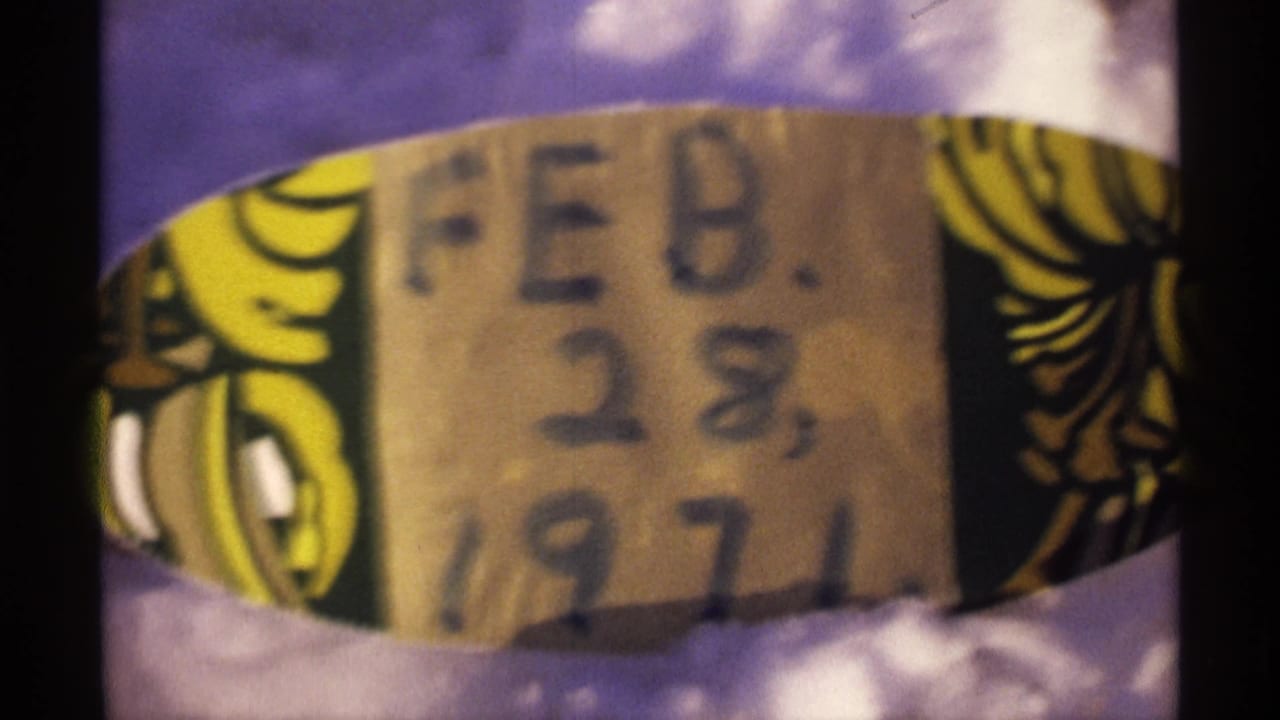 Close view of a handwritten FEB. 28, 1971 label on an 8mm reel, consistent with the Wisconsin 1971 clip metadata.