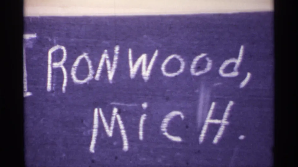 Duplicate title-card frame with handwritten Ironwood, Mich. label and snowy road scene above it.