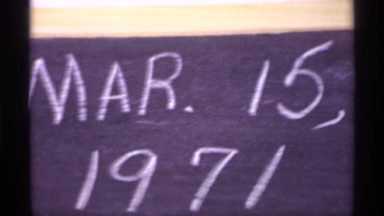 Handwritten chalk date reading Mar. 15, 1971 on a dark board.