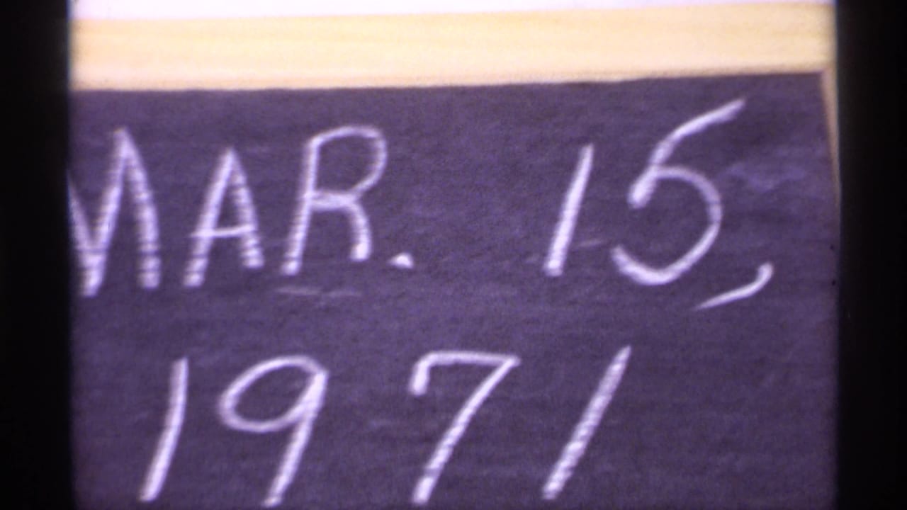 Close view of a chalkboard date reading Mar. 15, 1971.