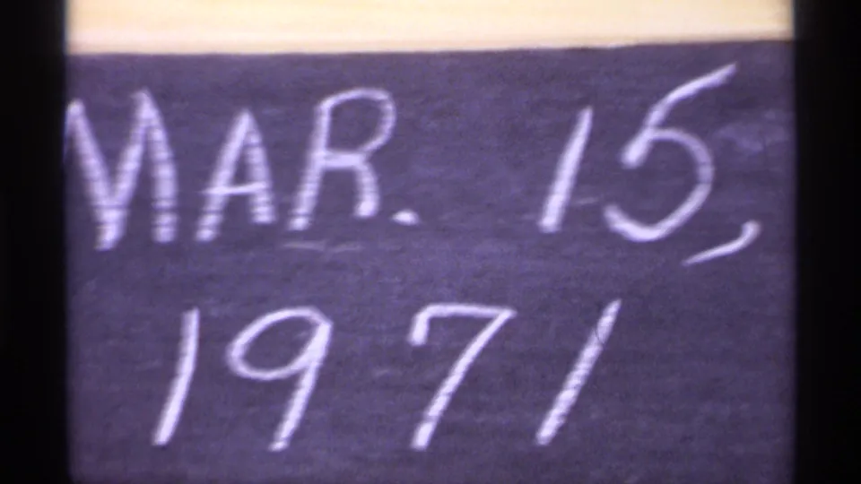 Partial 1971 Wisconsin home-movie date card, cropped closely on the handwritten chalk text.