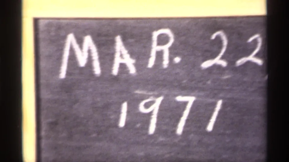 Close 8mm frame of a chalkboard-style date card reading MAR. 22 1971, confirming the filmed date metadata.