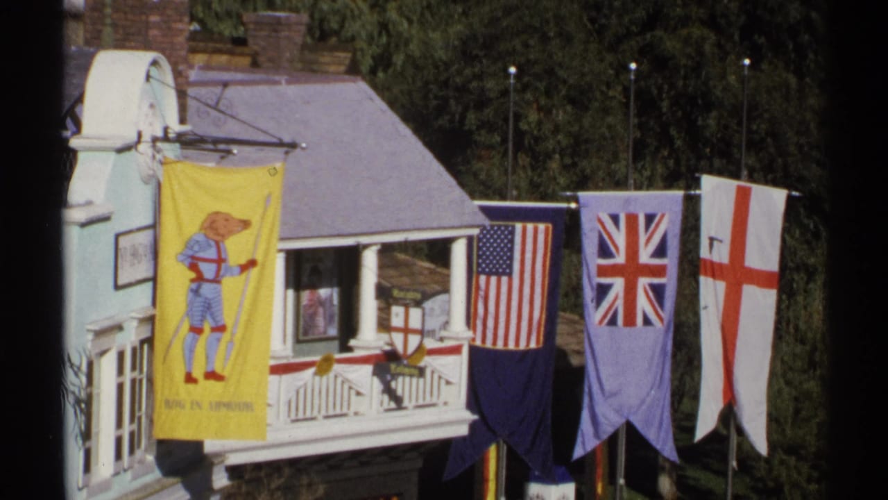 Small themed building with flags, balcony trim, and a yellow illustrated banner.