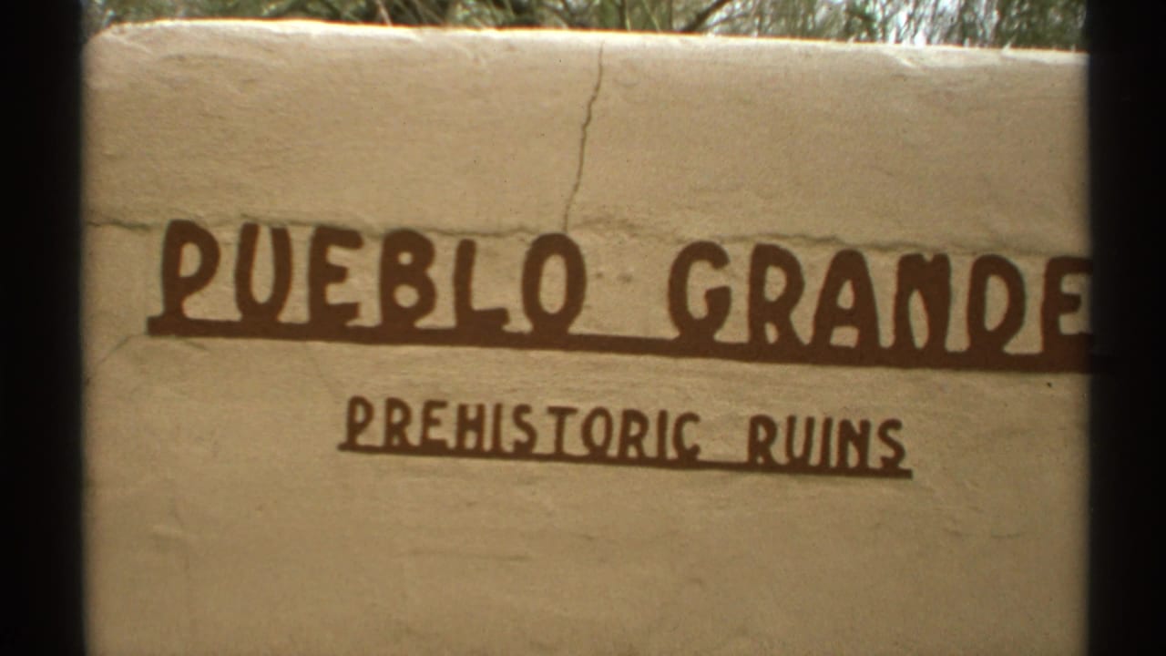 Stucco wall sign reading Pueblo Grande Prehistoric Ruins.