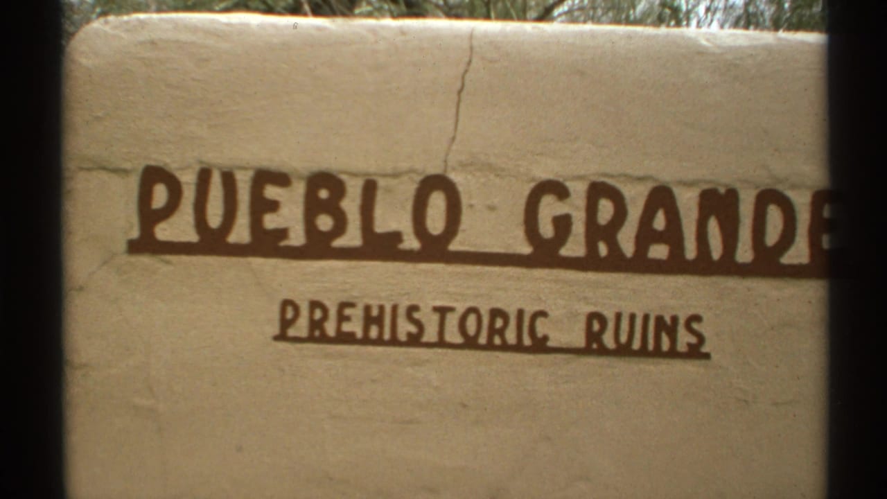 Pueblo Grande Prehistoric Ruins sign cropped by dark film borders.