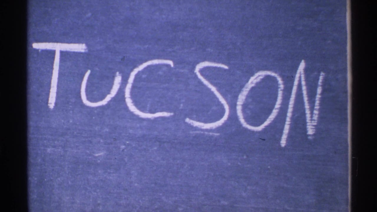 Handwritten Tucson title card in white chalk on a blue background, from archival 8mm Arizona footage dated 1972.
