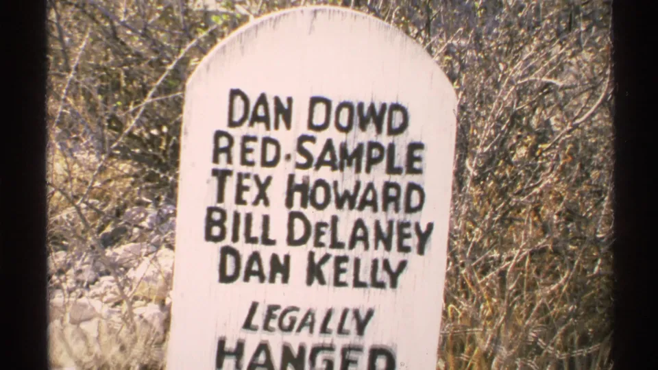 A 1972 Arizona 8mm frame shows a white marker listing Dan Dowd, Red Sample, Tex Howard, Bill Delaney, and Dan Kelly above Legally Hanged.
