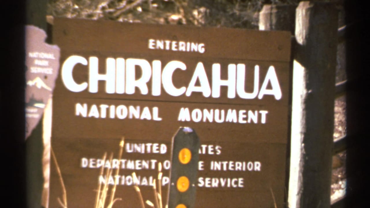 Chiricahua National Monument entrance sign with white lettering and NPS emblem.
