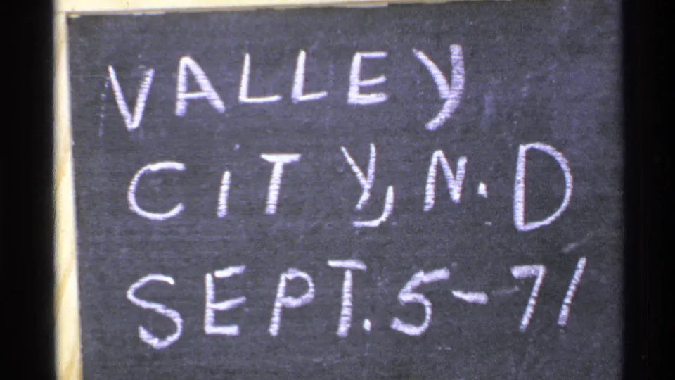 Handwritten chalkboard sign reads "VALLEY CITY, N.D. SEPT. 5-71" in early-1970s 8mm footage.