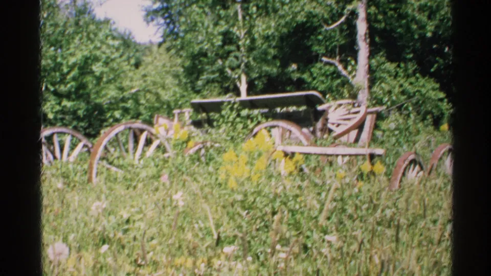 1972 Isle Royale frame showing the wooden wagon from a similar angle, softened by 8mm grain and handheld framing.