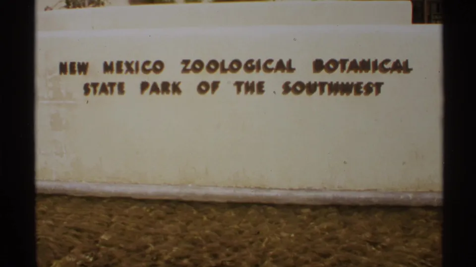 Raised lettering for the New Mexico Zoological Botanical State Park of the Southwest fills the upper part of this 1972 frame.