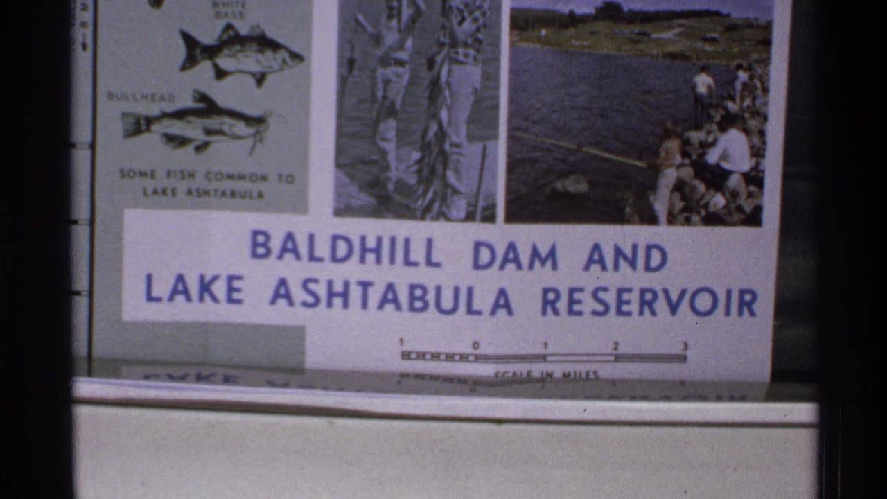 Close-up of the Baldhill Dam and Lake Ashtabula Reservoir sign behind dark film borders.