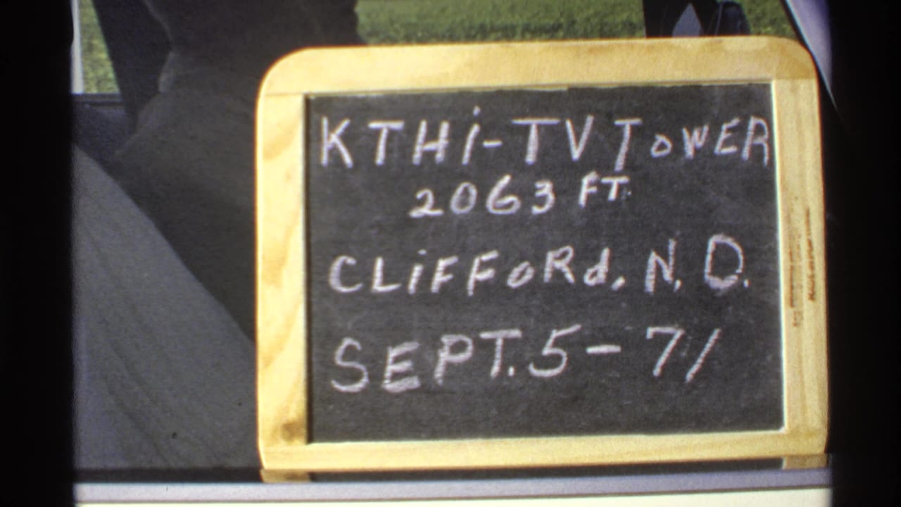 1972 8mm frame showing a chalkboard sign noting KTHI-TV Tower, 2063 feet, Clifford, North Dakota, dated September 5-7.