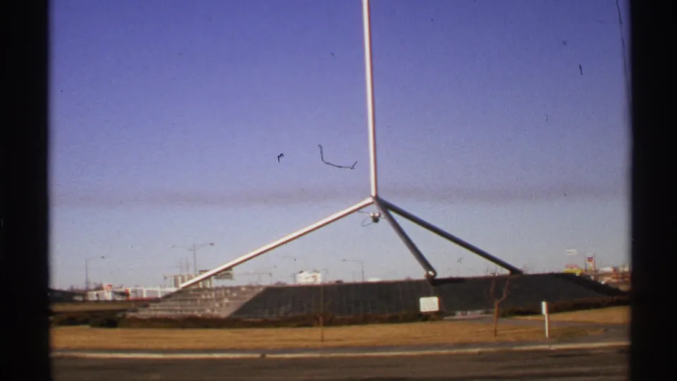 1972 Tulsa 8mm frame showing the Mabee Center area at Oral Roberts University from a roadside vantage.