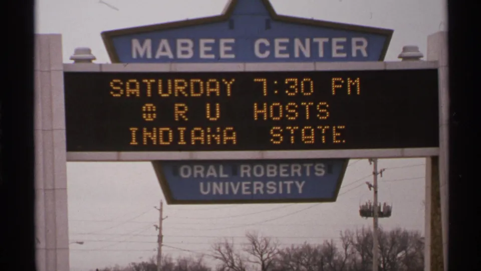 Tulsa 1972 frame of the Mabee Center sign announcing ORU hosts Indiana State at 7:30 PM.