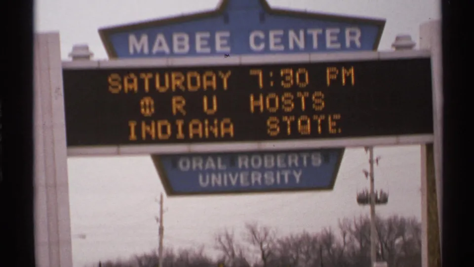 A second 1972 Tulsa view of the Mabee Center marquee showing ORU hosts Indiana State above the Oral Roberts University sign.