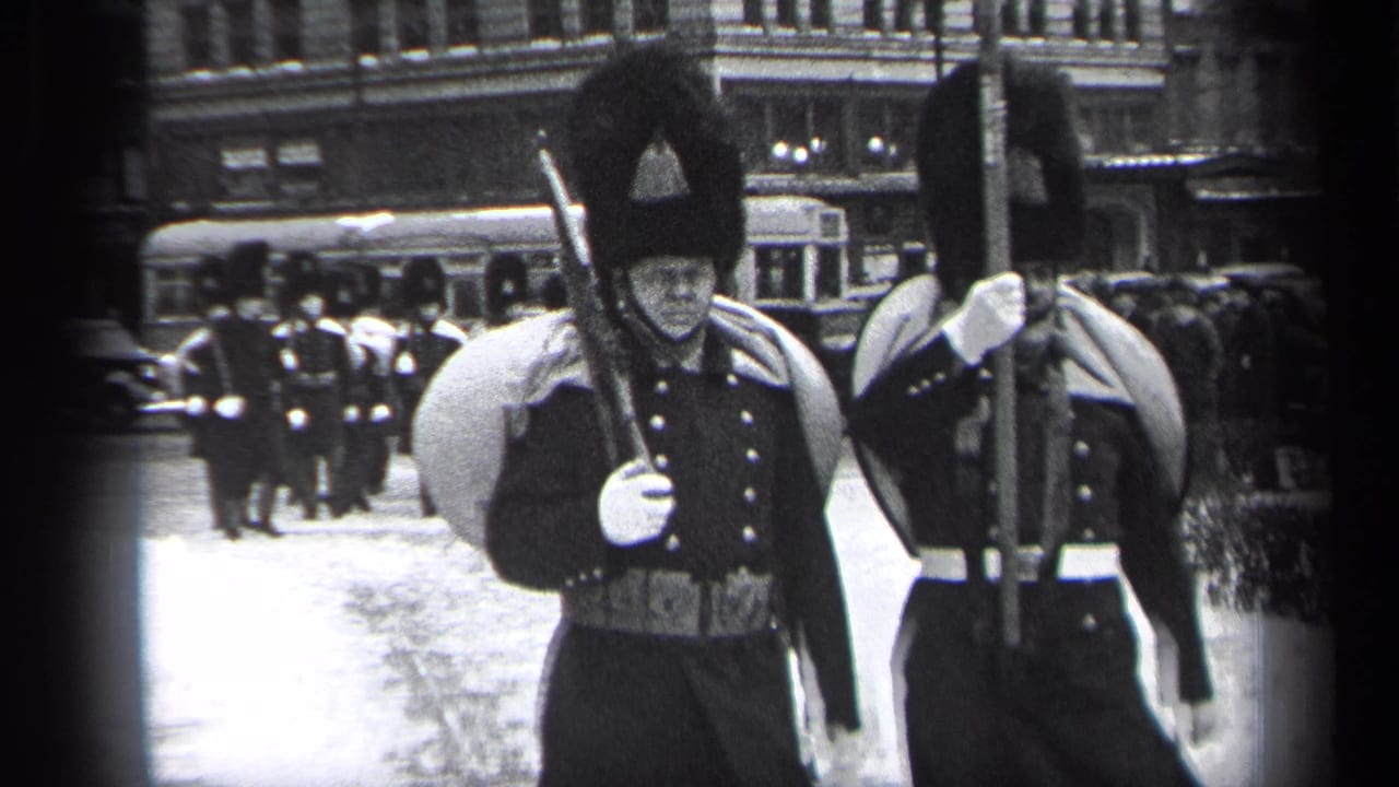 In the supplied 1937 Cleveland footage, soldiers in formal uniforms and tall hats march past the camera with rifles and white gloves.