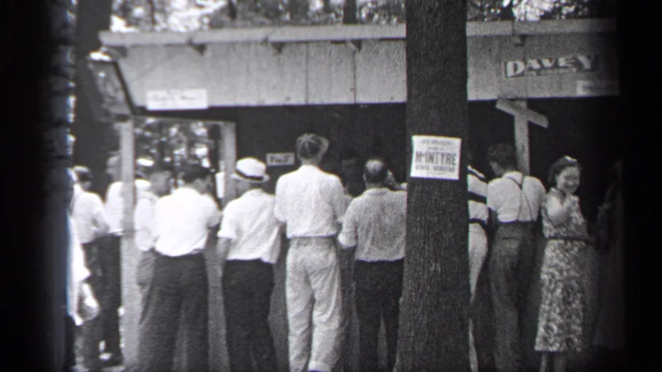 Adults in period clothing gather at a Cleveland entrance area in 1937, with the DAVEY mark above and a posted tree sign in the foreground.