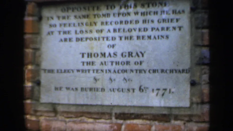 1949 England home-movie close-up of the Thomas Gray memorial plaque, including text about his burial in 1771.