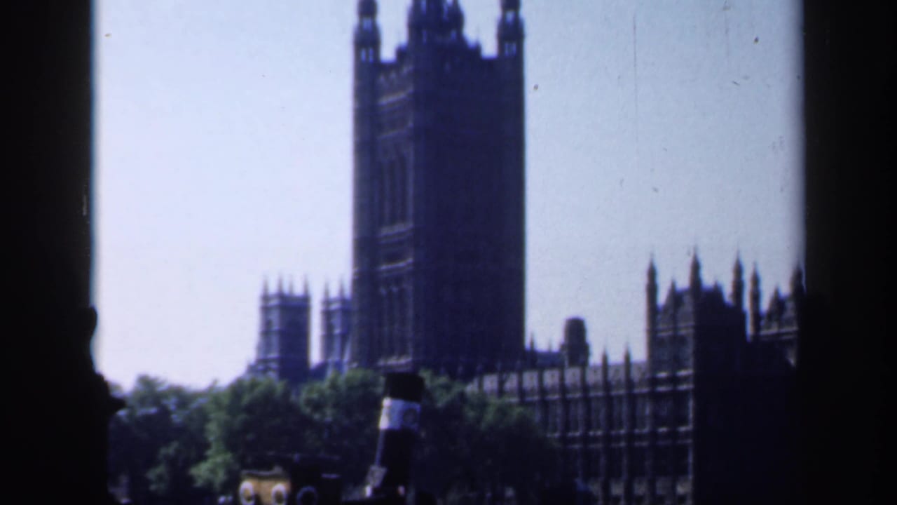 1949 England home-movie view of Elizabeth Tower and the Palace of Westminster from a riverside position.